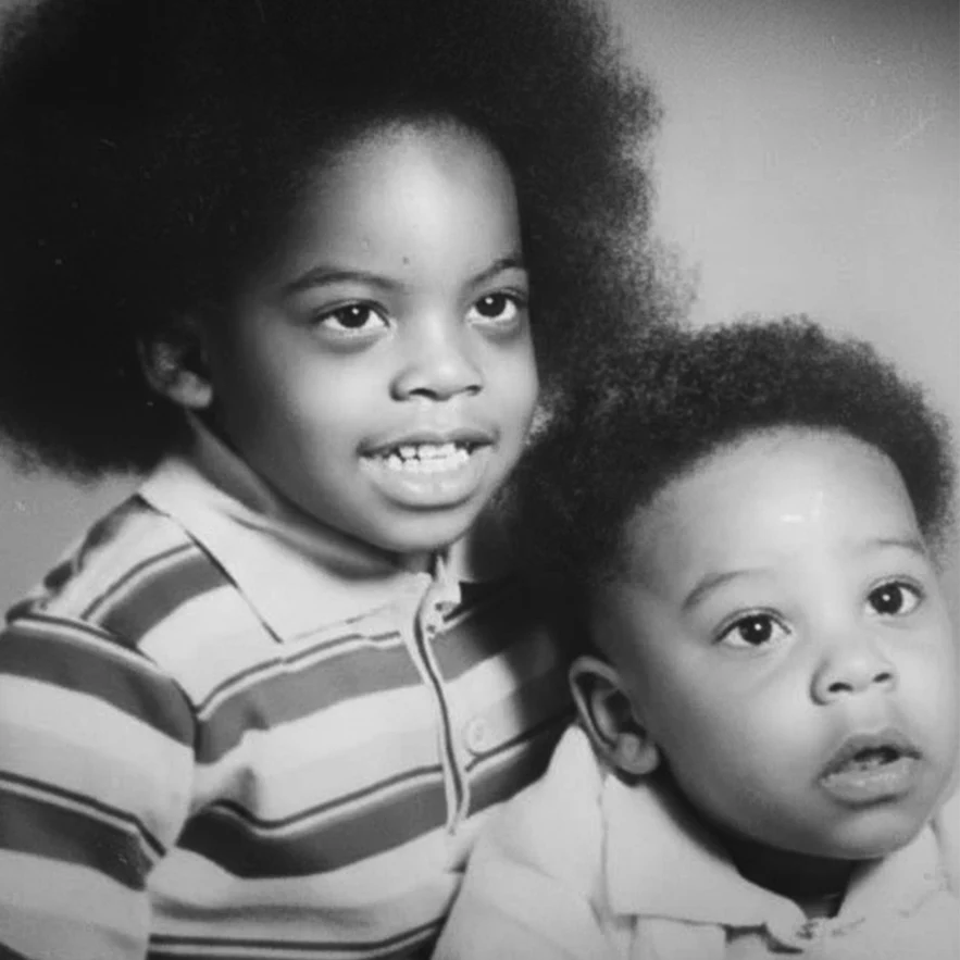 Brandon and Julius Burrell as young brothers — a vintage black-and-white childhood portrait